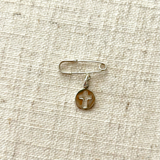 Silver safety pin with cut - out cross medal